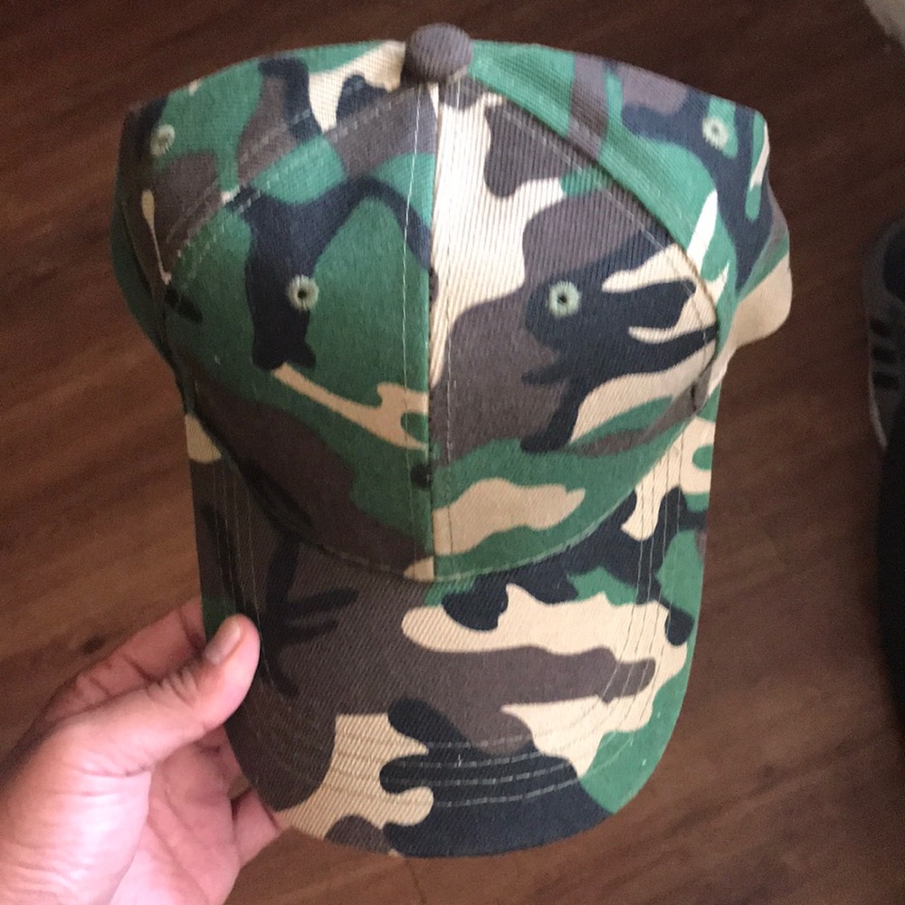 Brand new camo hat never worn, made in Bangladesh.